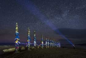 The offering poles of Shamanka Rock at night